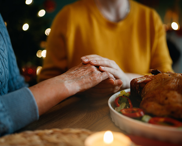seniors holding hands at thanksgiving